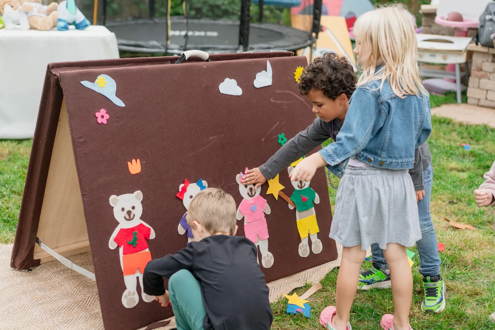 Kids enjoying the interactive felt wall